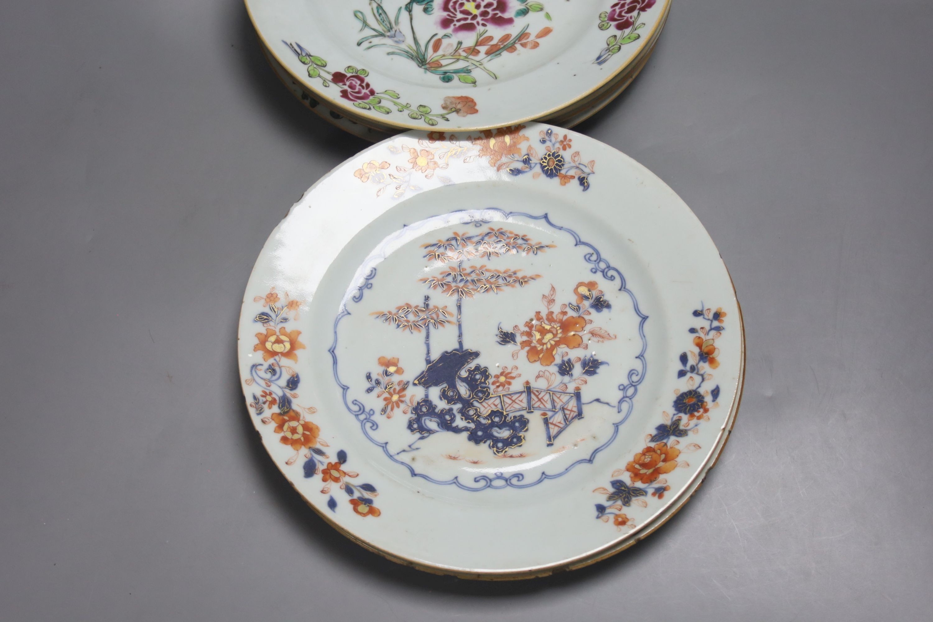 Two 18th century Chinese export blue and white plates, a pair of Chinese Imari patterned plates and four famille rose plates